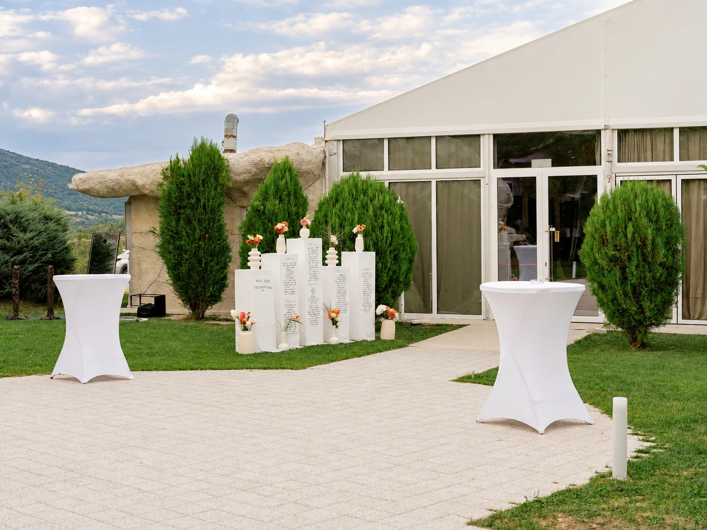 Cocktail tables outside the wedding marquee