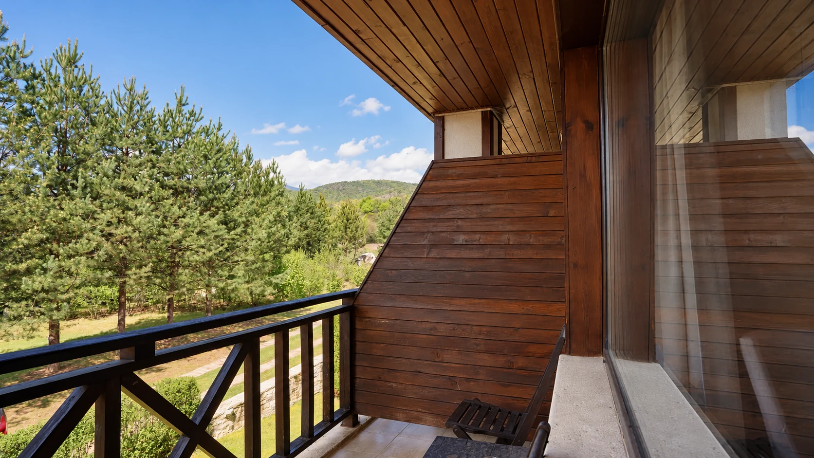 Hotel room terrace overlooking greenery